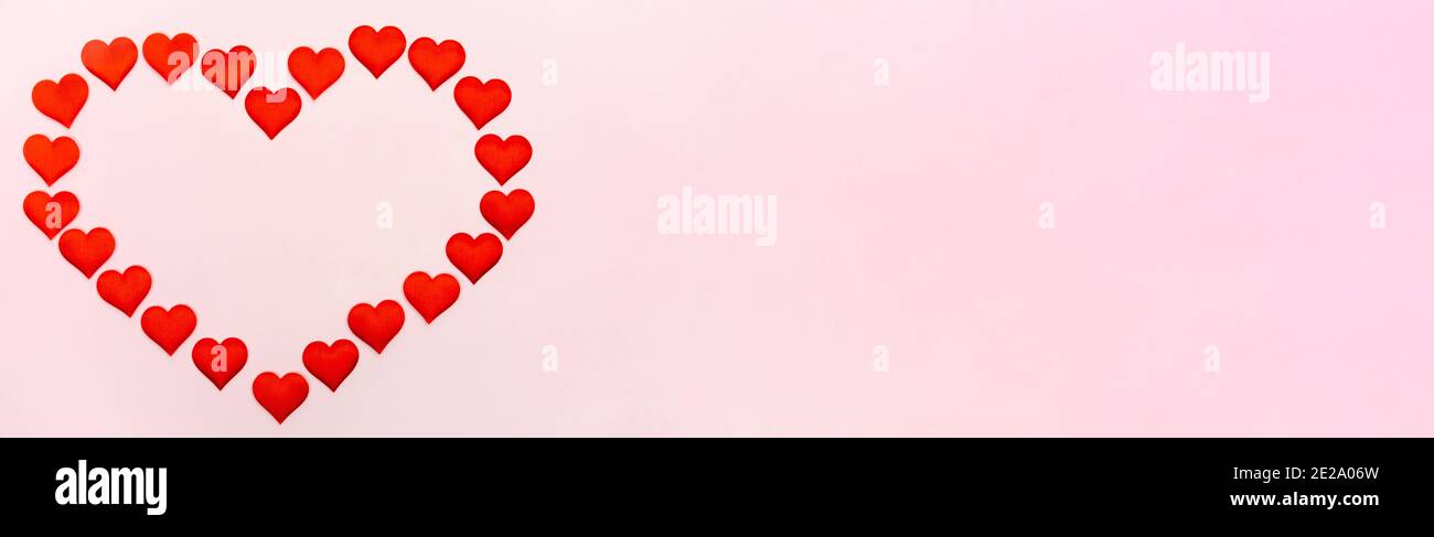 Banner big heart of small hearts mock-up on a pink background. Concept of holidays and Valentines Day. Stock Photo