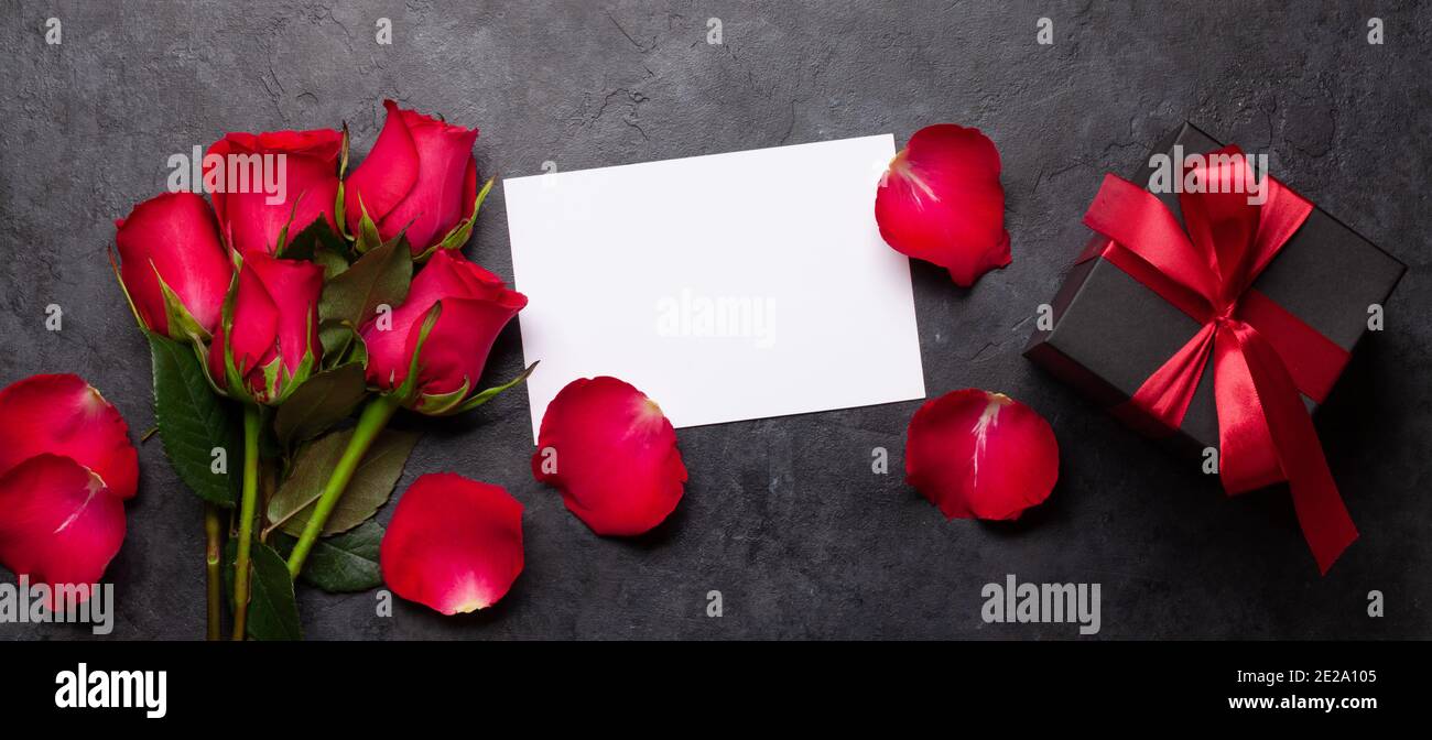 Valentines day greeting card with red rose flowers and gift box. Top ...