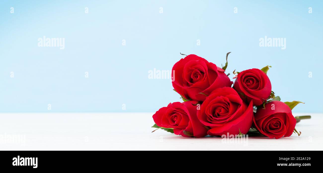 Valentines day greeting card with red rose flowers bouquet on wooden ...