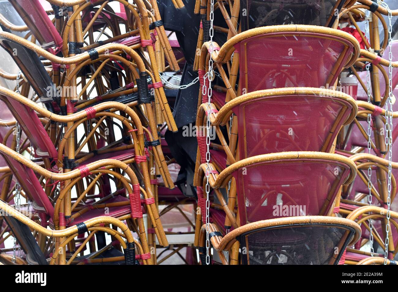 Munich, Deutschland. 12th Jan, 2021. Topic picture: Coronavirus pandemic/consequences for the gastronomy: stacked chairs in the outdoor area of a restaurant in Munich on January 12th, 2021. | usage worldwide Credit: dpa/Alamy Live News Stock Photo