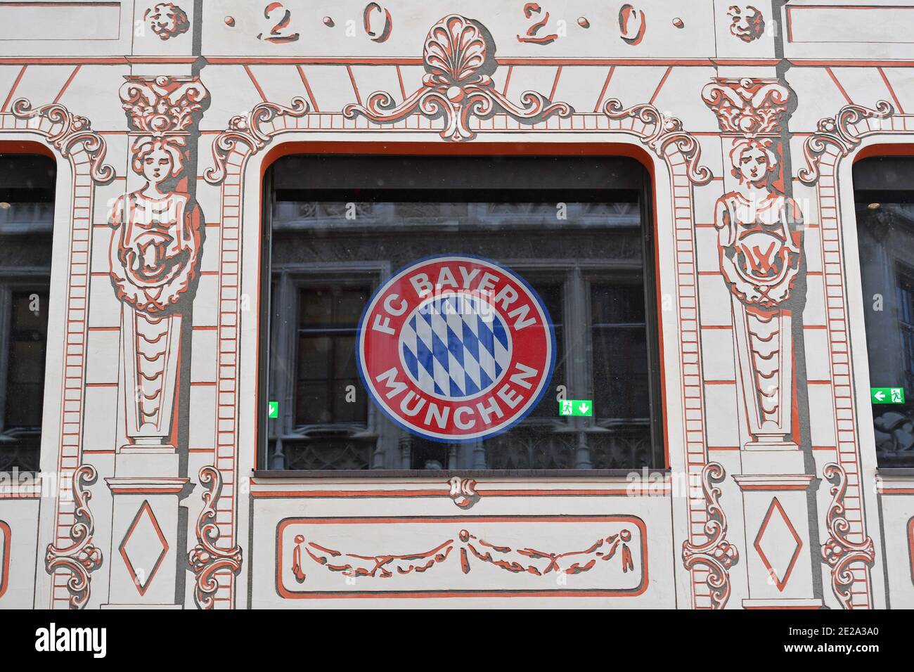 Munich, Deutschland. 12th Jan, 2021. FC Bayern Munich's club crest hangs in a window of FC Bayern World in Weinstrasse in Muenchen on January 12th, 2021. | usage worldwide Credit: dpa/Alamy Live News Stock Photo