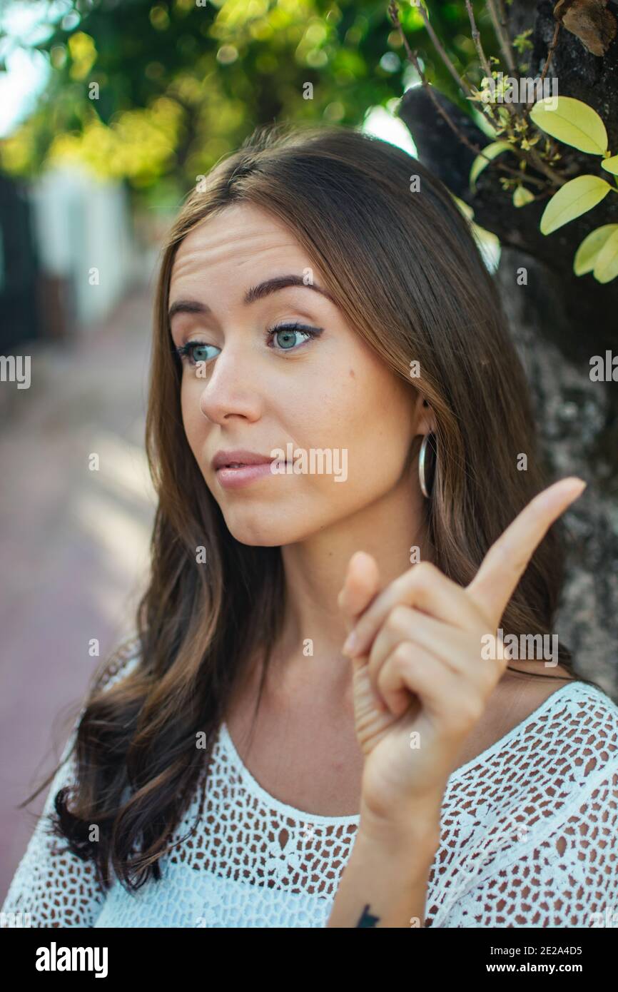 Woman eyes up finger hi-res stock photography and images - Alamy