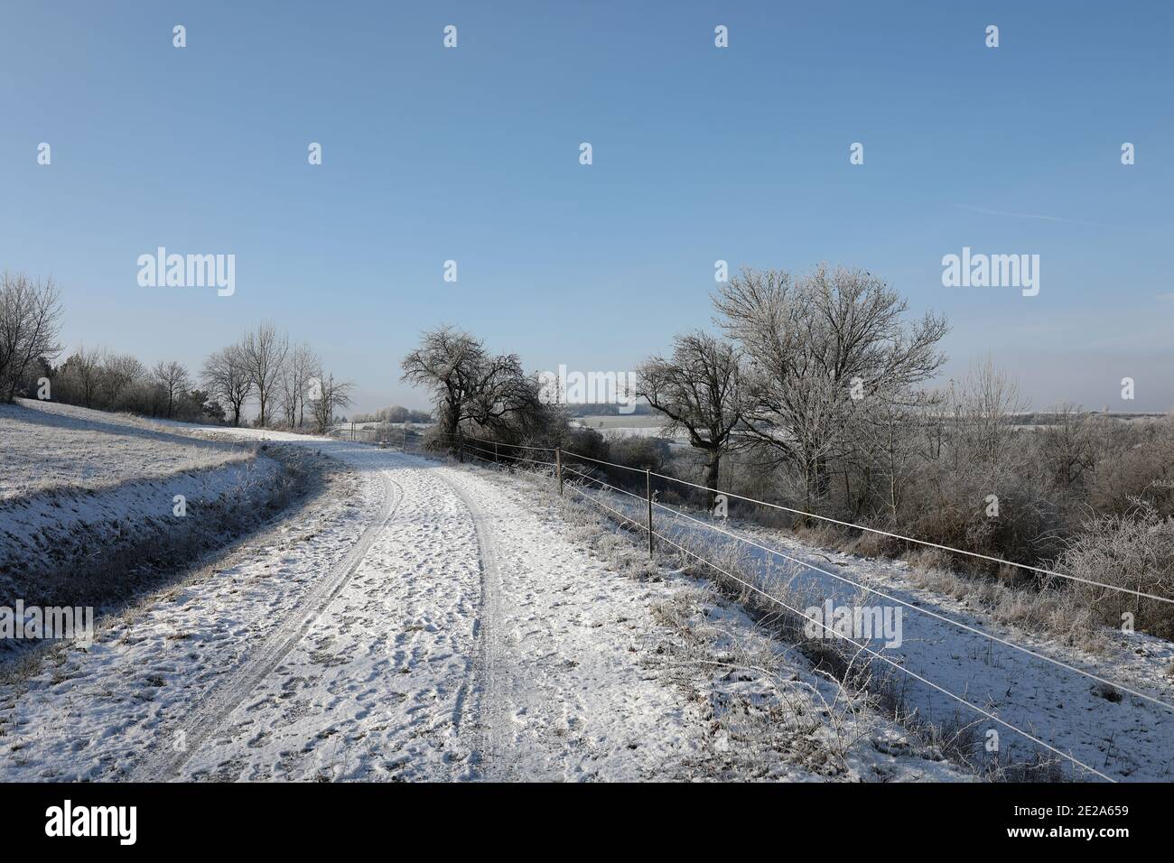 Winter landscape with snowy fields and blue sky Stock Photo - Alamy