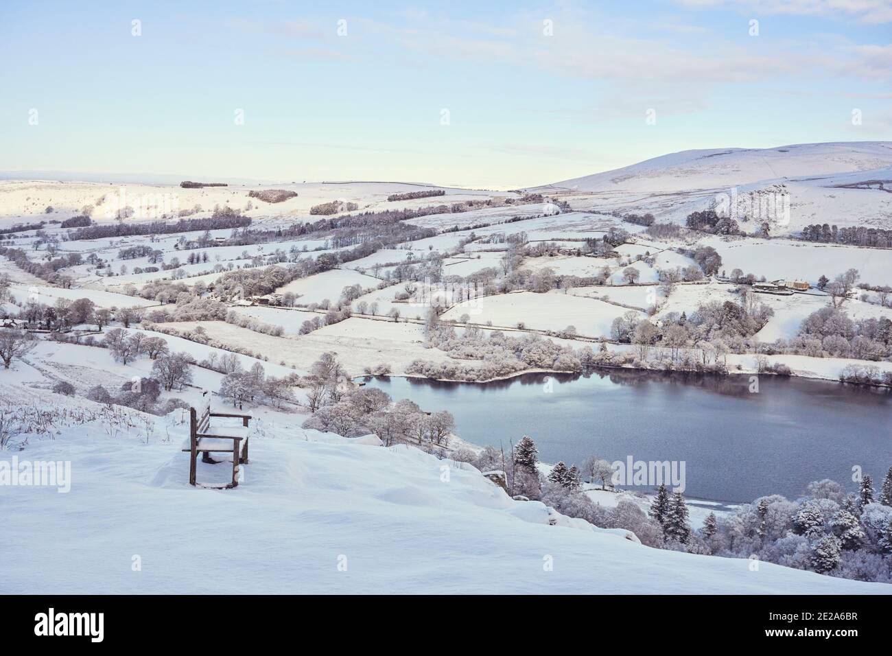 Bench overlooking a wintry Loweswater, Lake District Stock Photo