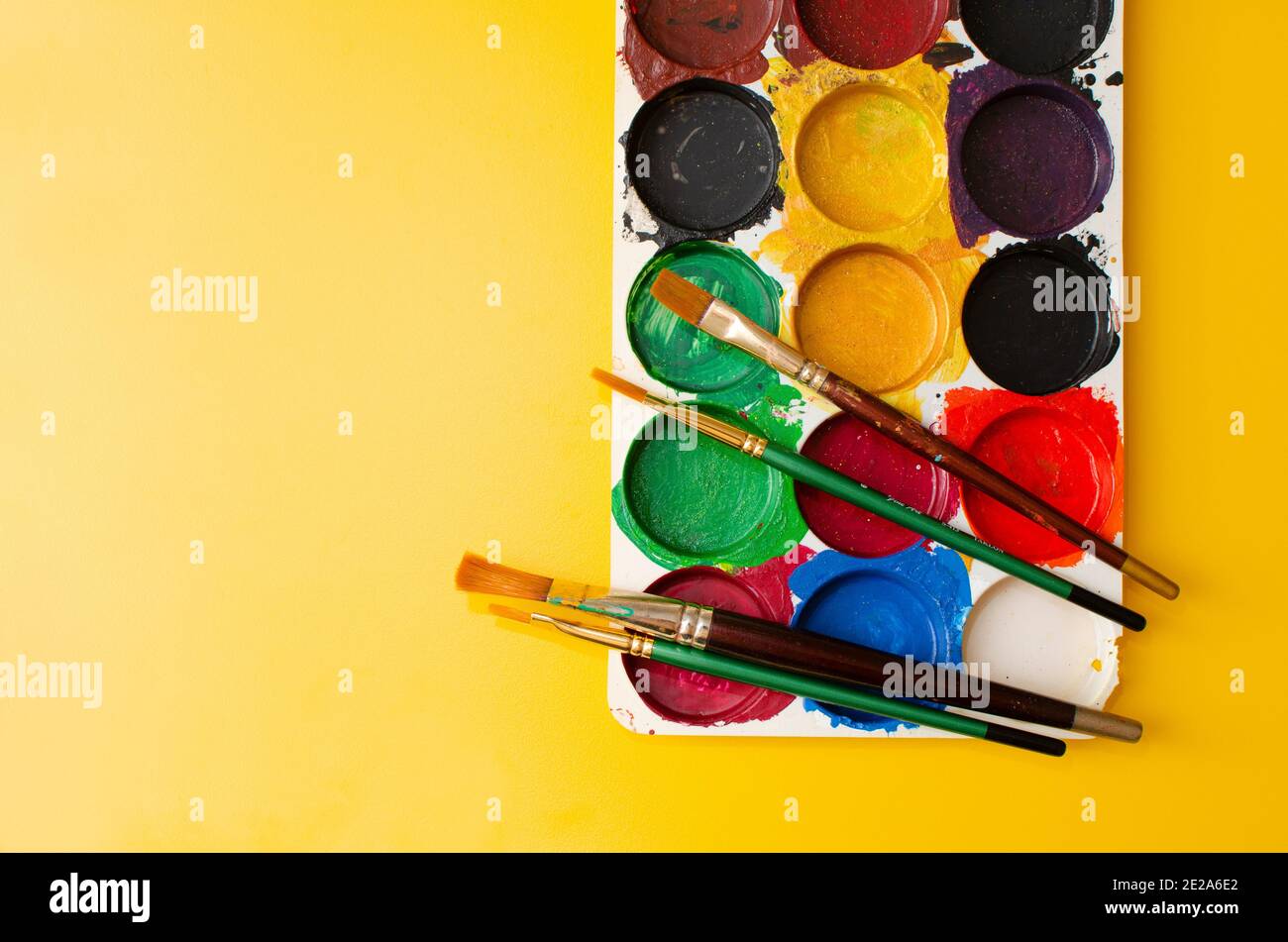 Used Acrylic Colours and Brushes. Palette placed on yellow Coloured Board, Top Angle View