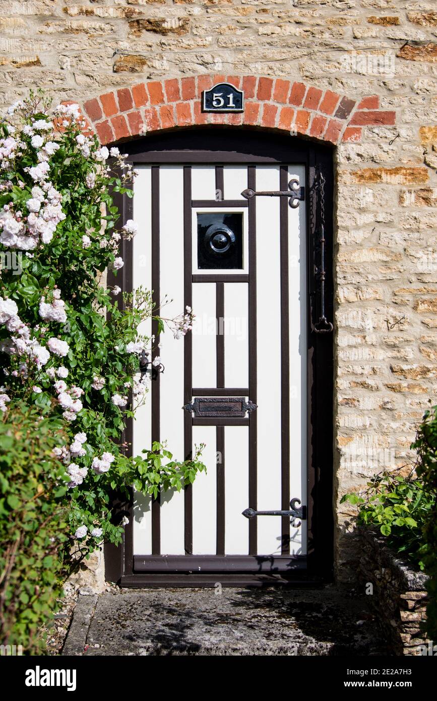 Front door of period Cotswold cottage, Tetbury, Gloucestershire, UK Stock Photo