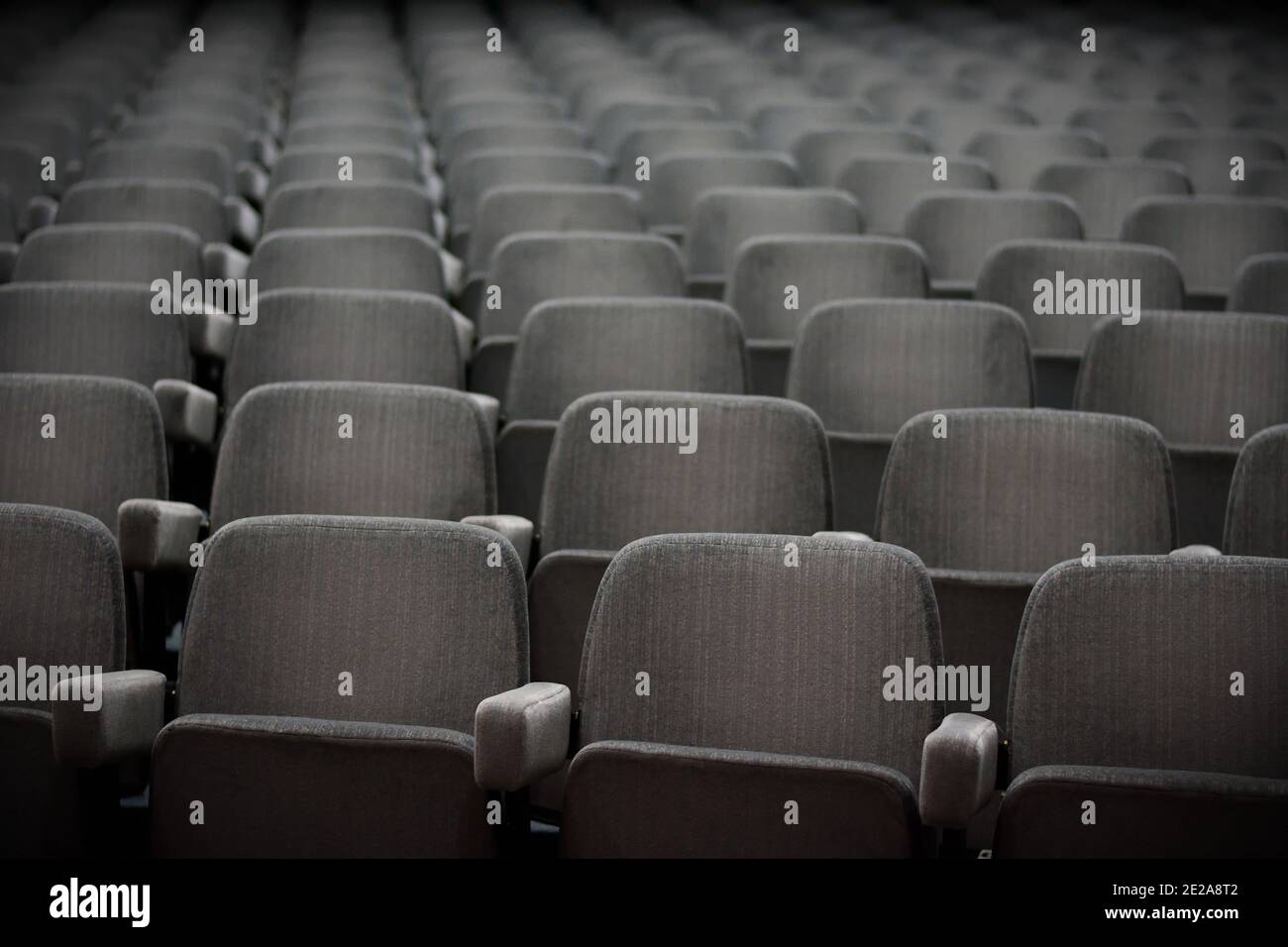 Empty rows of theater or movie seats. Stock Photo