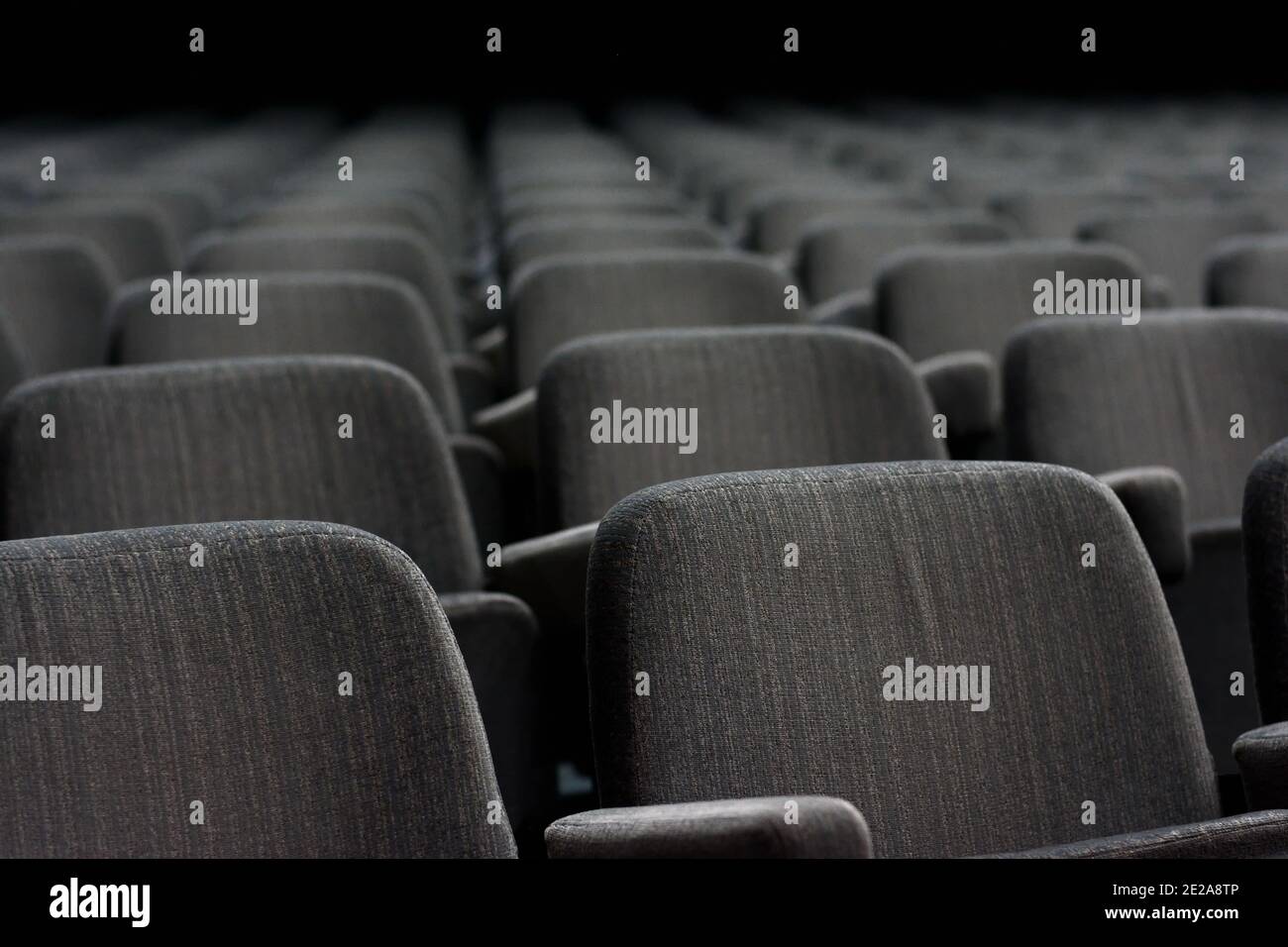 Empty rows of theater or movie seats. Stock Photo