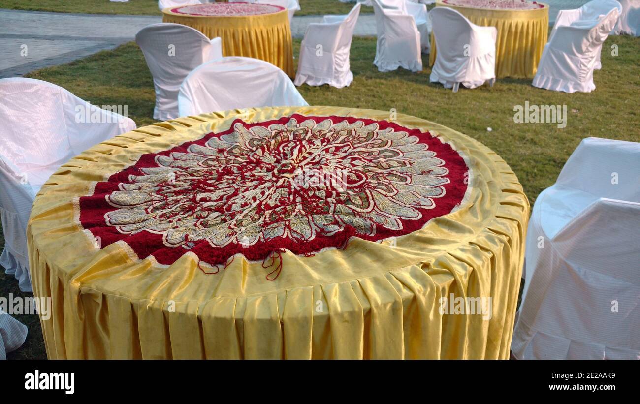 Round beautiful table decorated for a marriage celebration in Indian wedding with chairs arranged Stock Photo Alamy
