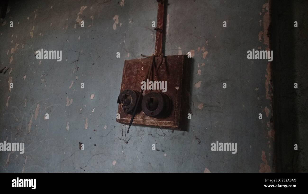 Old rusty electric switchboard from the late '70s in an Indian rural