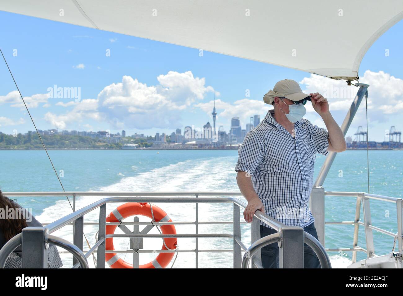 A passenger wearing face mask on Fullers ferry Stock Photo