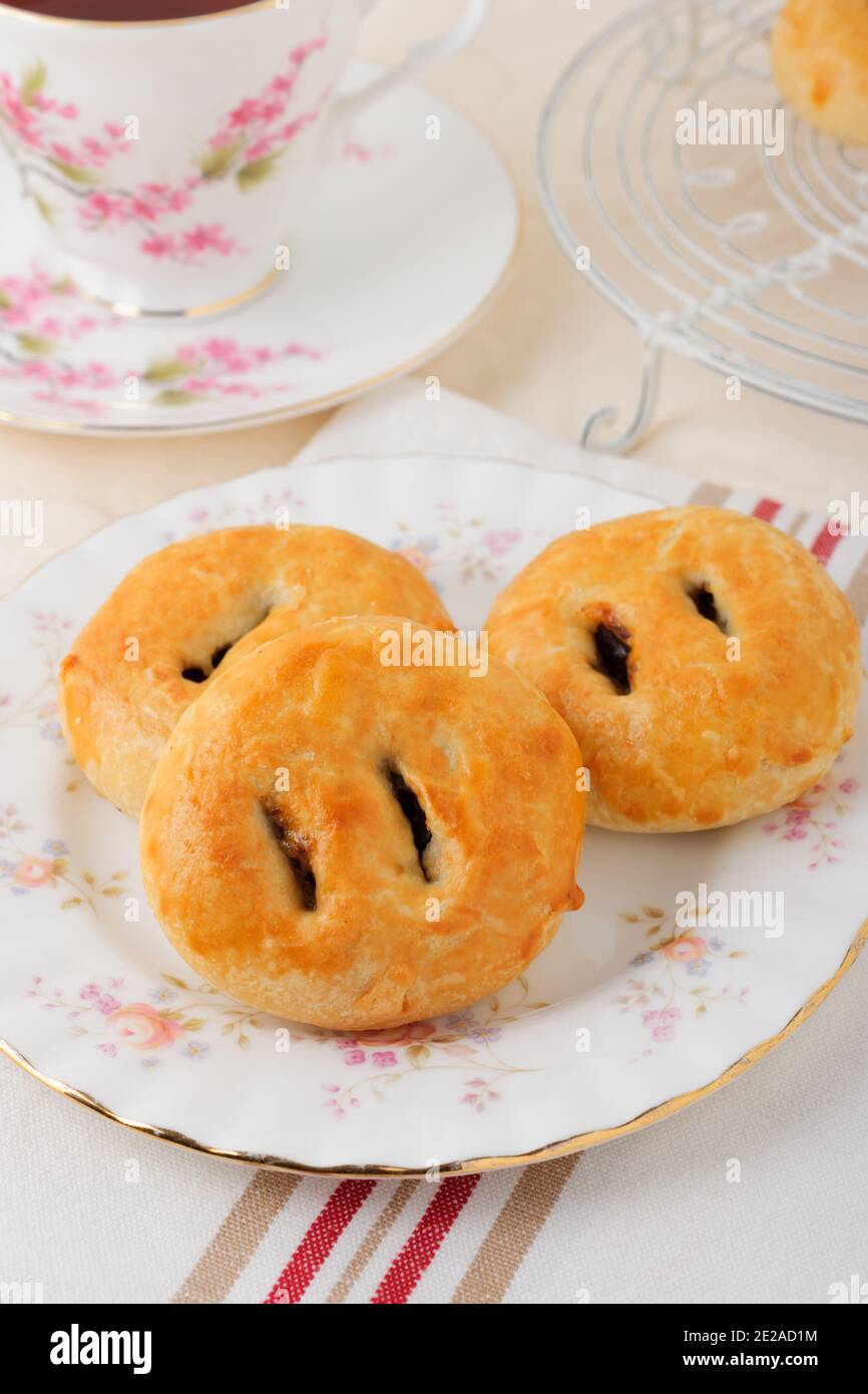 Eccles cakes a small round pastry filled with currants or raisins originating from the town of Eccles in Lancashire England Stock Photo