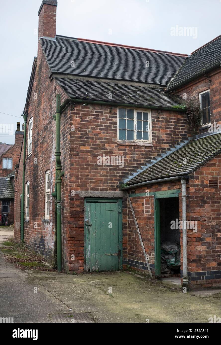 Brick outhouse and yard example Stock Photo Alamy