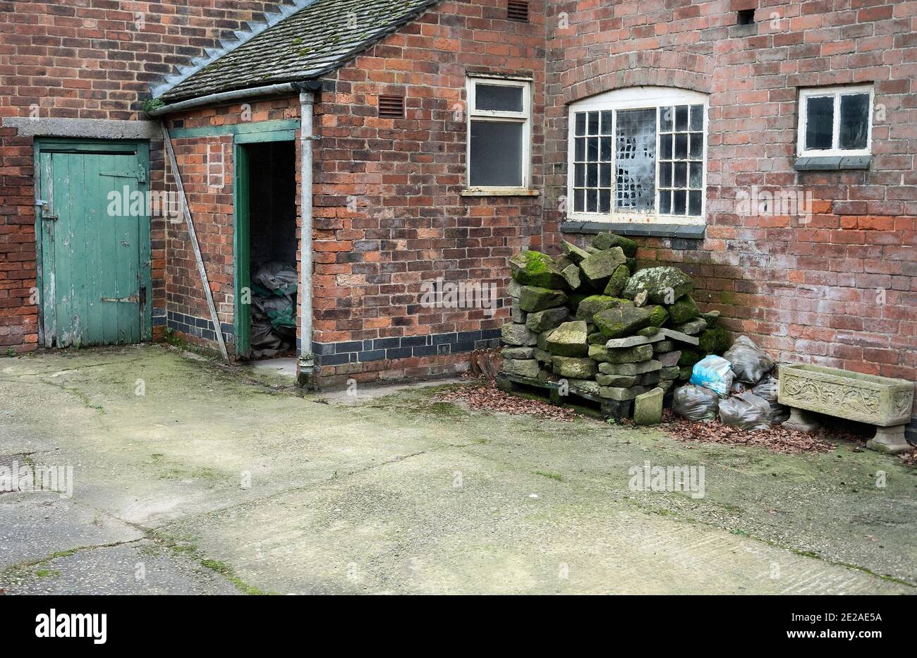 Brick outhouse and yard example Stock Photo Alamy