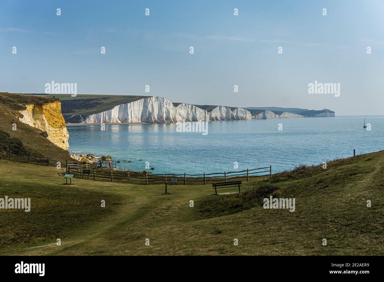 View to the white cliffs of Seven Sisters at Hope Gap on the South Downs Way cliff top walk at the South Downs National Park, East Sussex Stock Photo