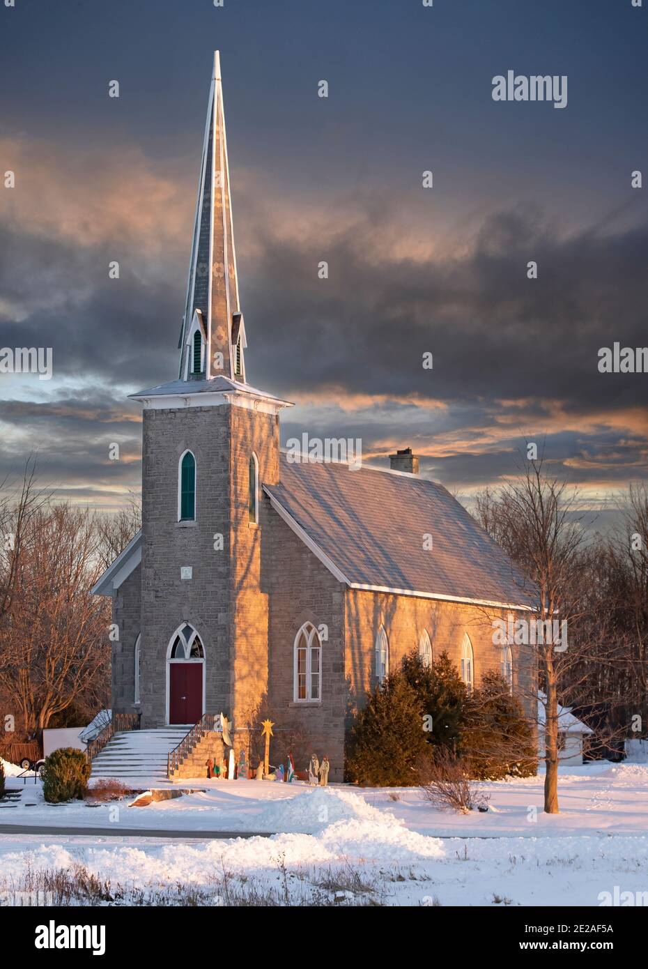 Old stone church at sunset on a cold winter day in rural Canada Stock Photo