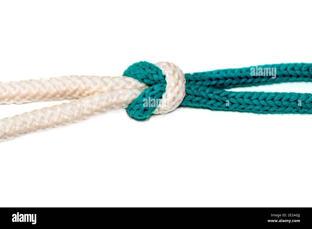 The Reef (Square) Knot on white background a Binder Knot is easy tied and will not jam, so it is always easy to untie Stock Photo