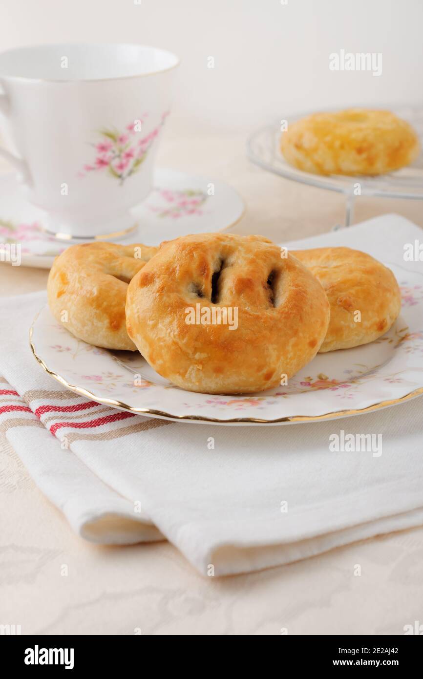 Eccles cakes a small round pastry filled with currants or raisins originating from the town of Eccles in Lancashire England Stock Photo