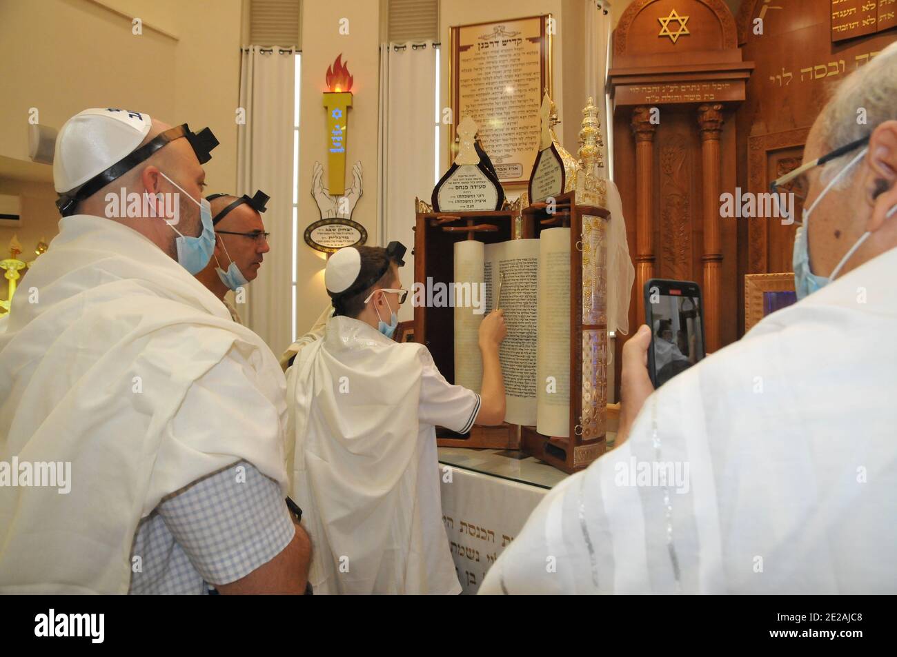 Bar Mitzvah concept A Jewish boy of thirteen is performing the rites to manhood Stock Photo