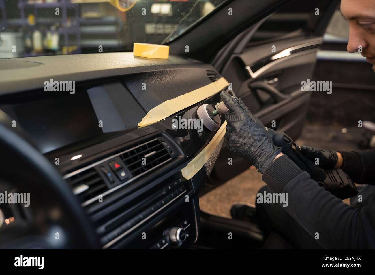 Professional polishing car interior trim. Auto detailing concept Stock