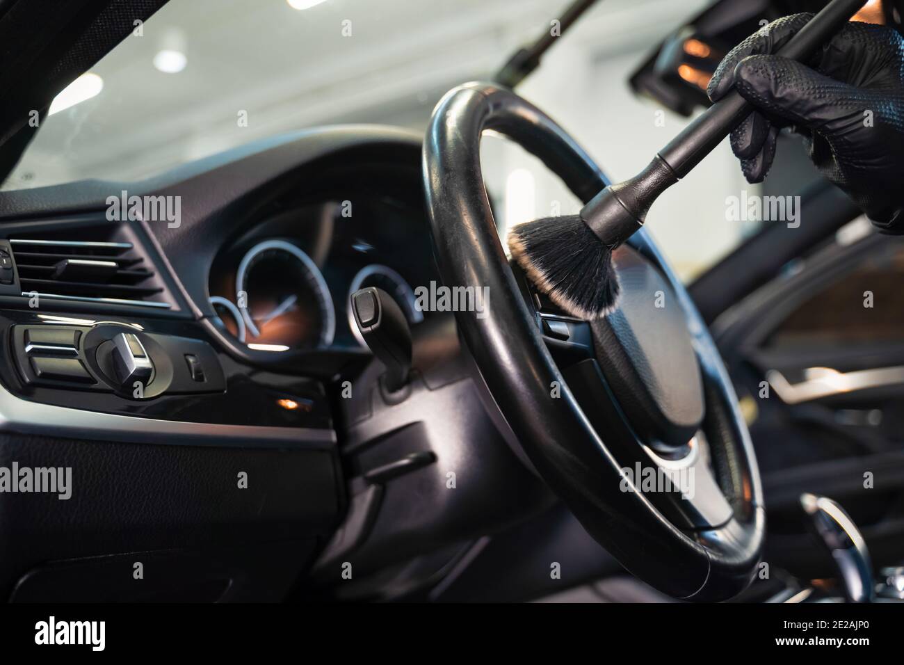 Professional car cleaning. Cleaning the steering wheel of car from dirt