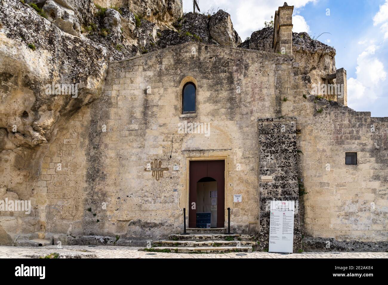 Entrance of the church of Santa Maria De Idris, one the the oldest cave church in Sassi di Matera historic district. Matera, Basilicata, Italy, August Stock Photo