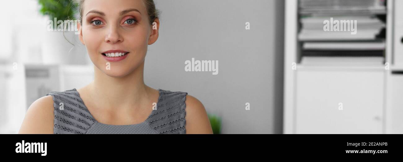 Happy smiling female clerk working with documents Stock Photo