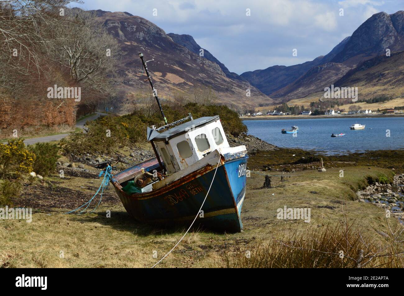 Old Fishing Boat Beached at Loch Long in the Scottish Highlands Stock Photo