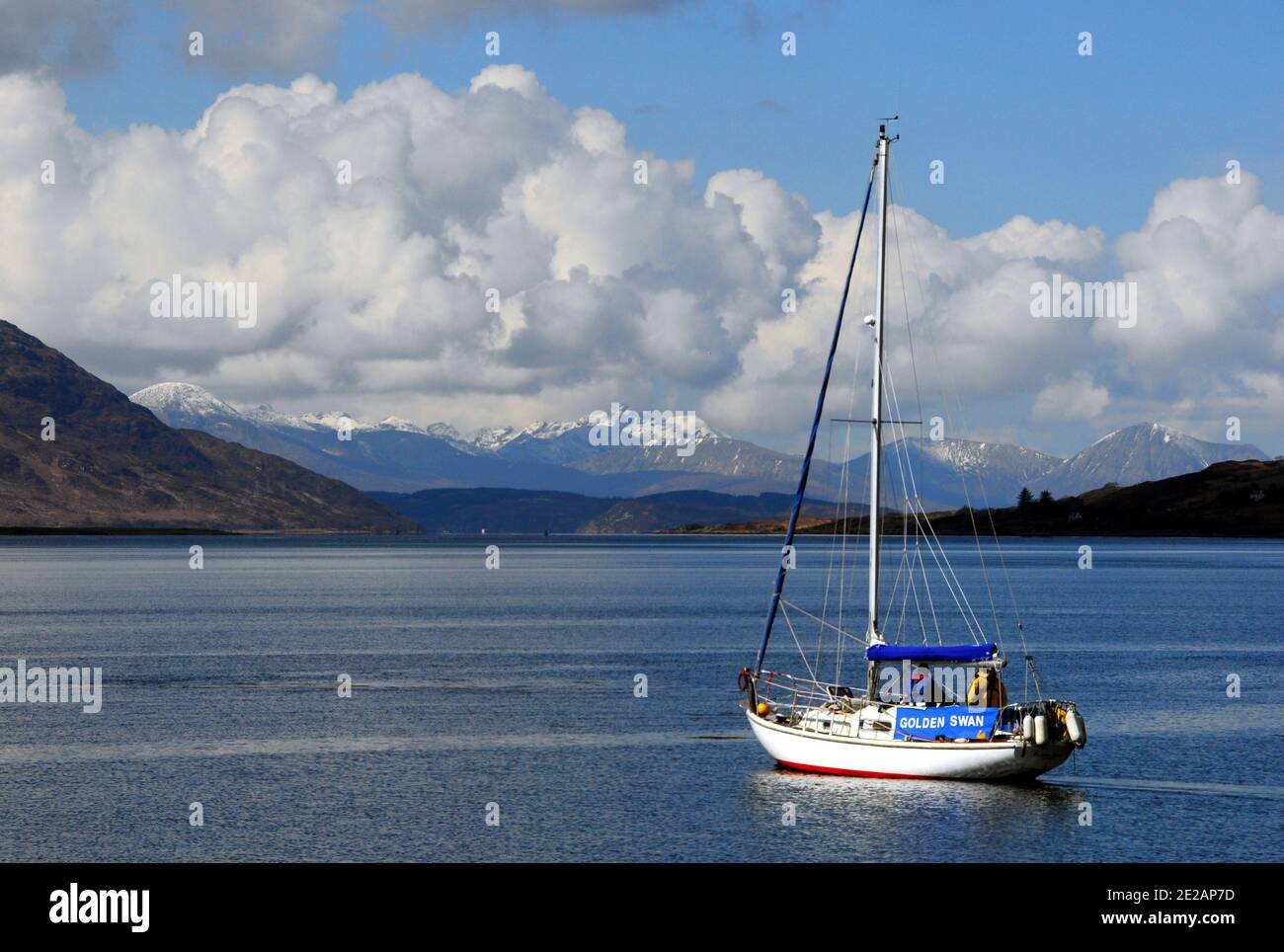 Sailing boat about to leave anchorage in Loch Alsh in the Scottish Highlands looking towards Skye Stock Photo
