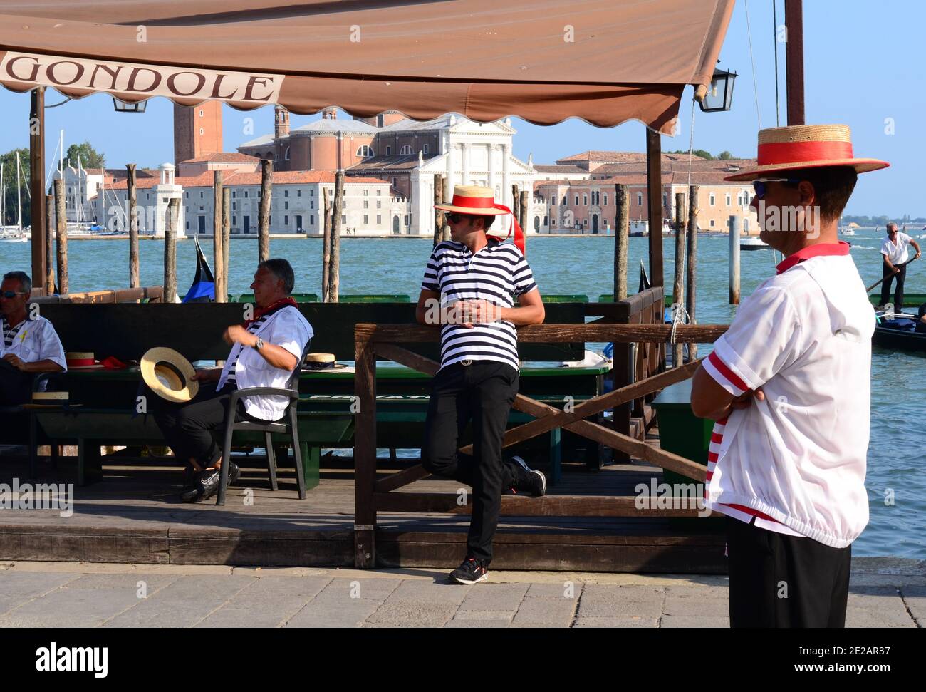 Gondoliers waiting for clients. Empty Venice, Italy Stock Photo