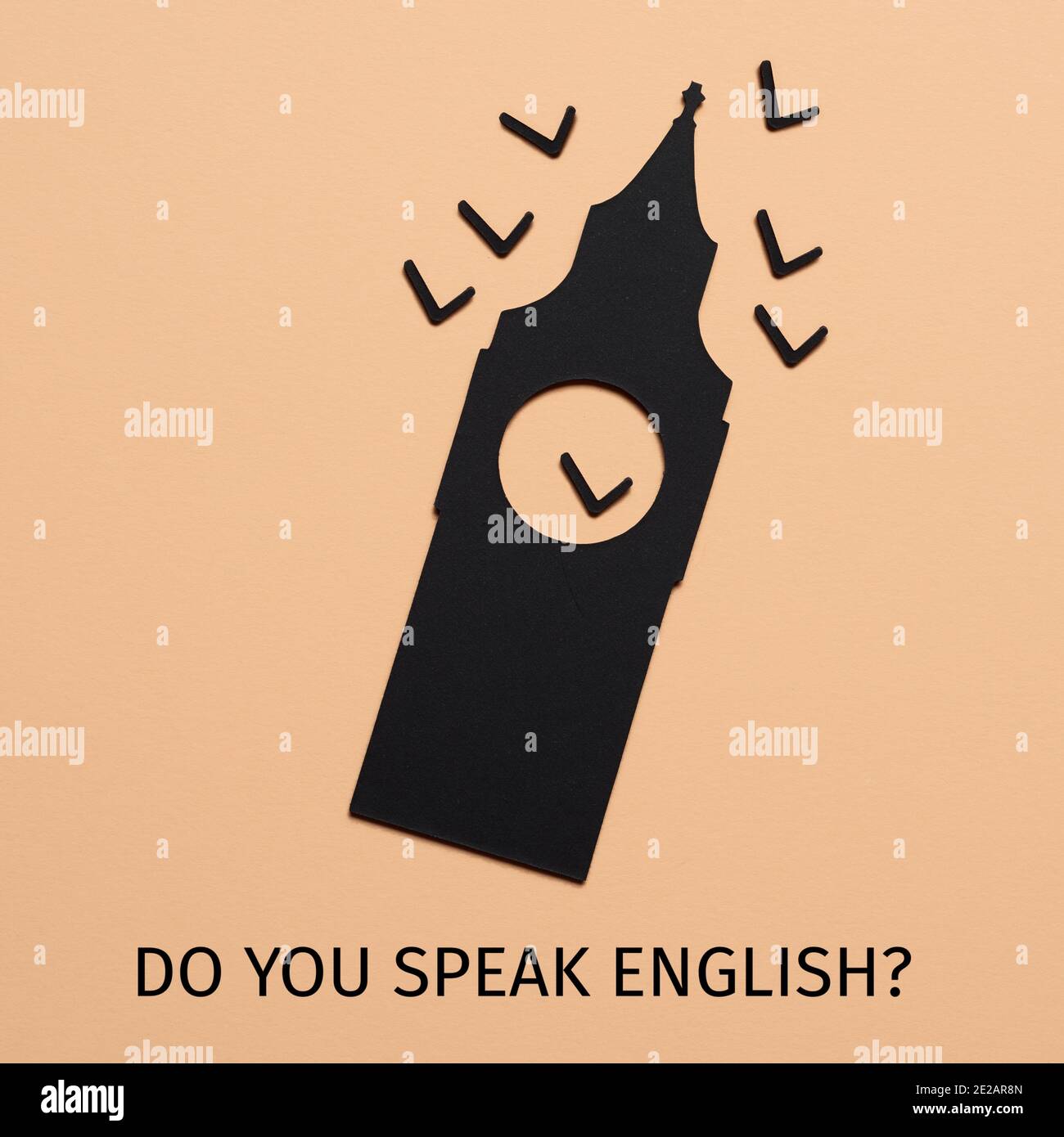 the big ben, cutout on a black paperboard, and the question do you speak english written on a pale brown background Stock Photo