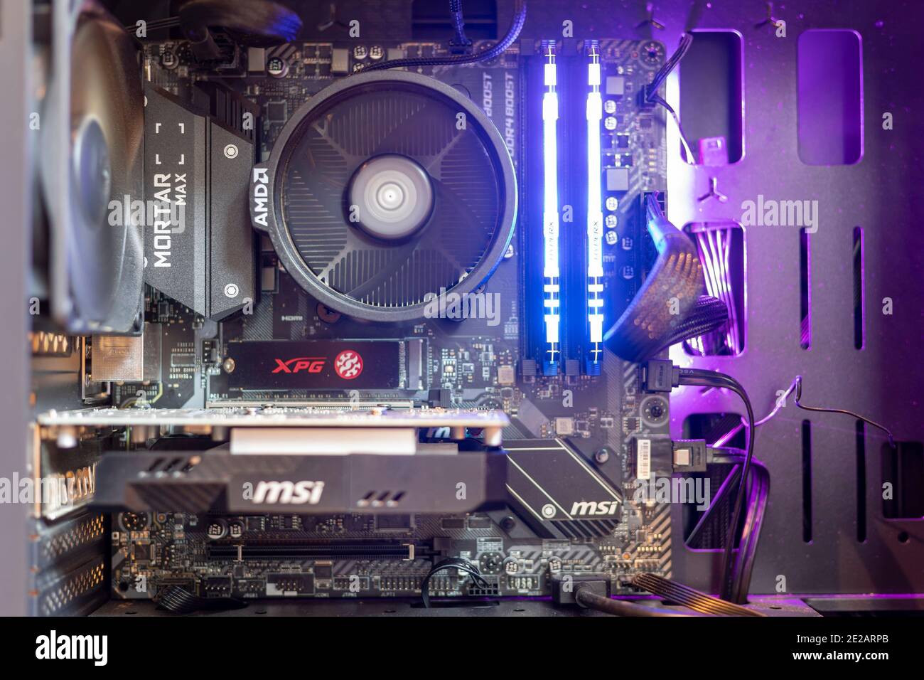 Inside of a Windows pc, showing pc motherboard,RGB RAM,GPU and fans Stock Photo