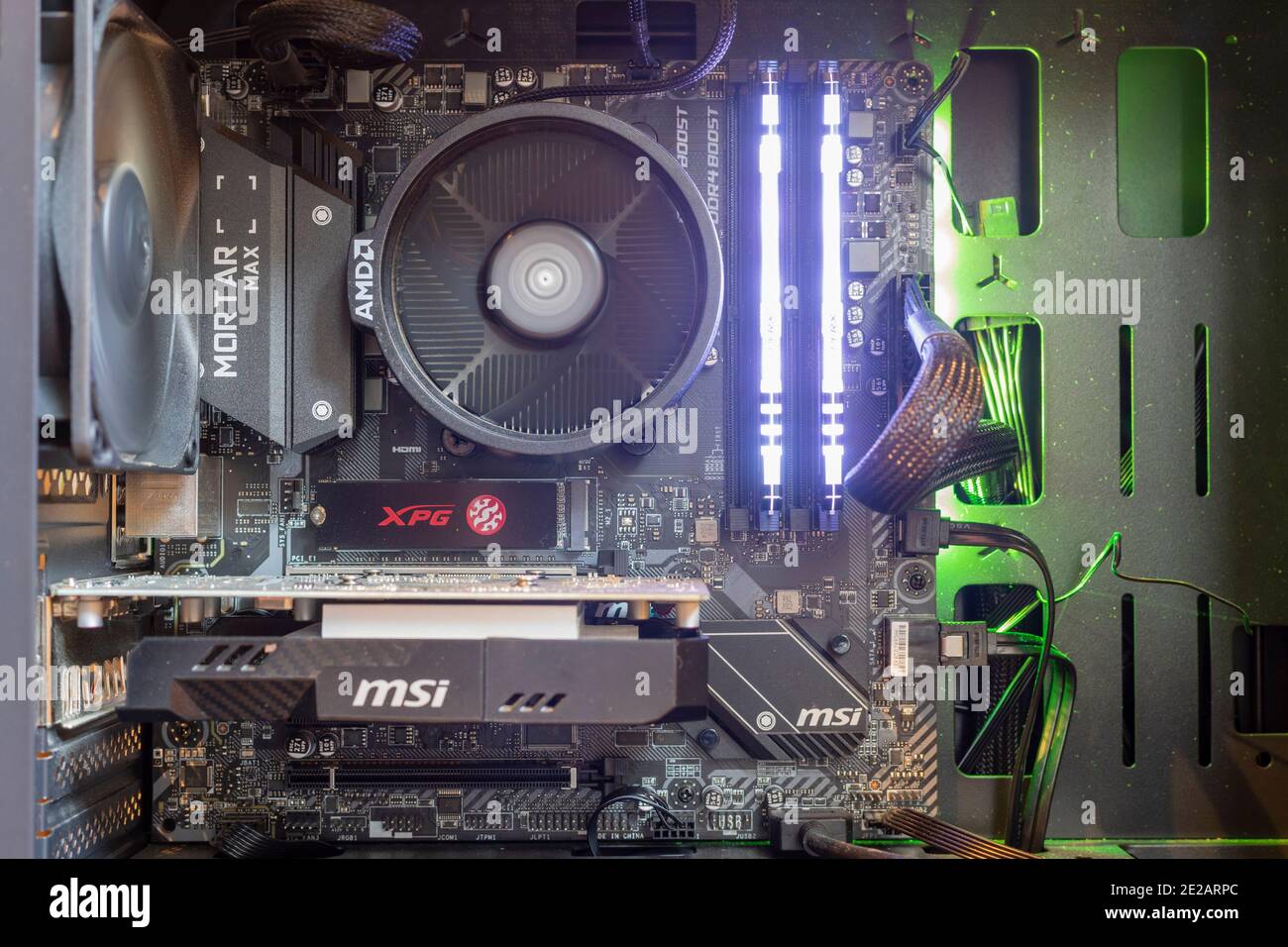 Inside of a Windows pc, showing pc motherboard,RGB RAM,GPU and fans Stock Photo