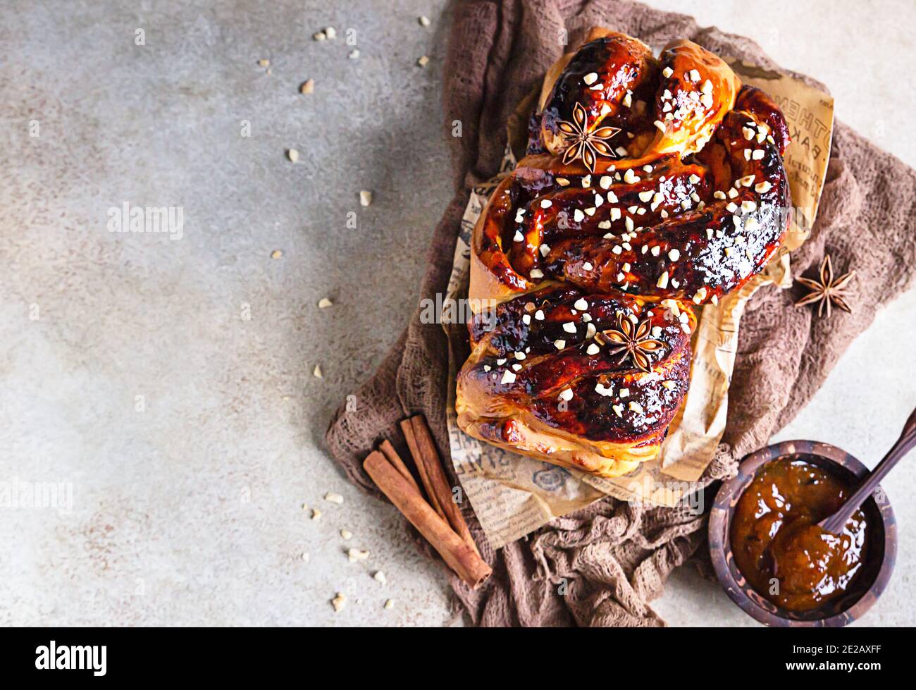 Swirl brioche with apricot jam, nuts, cinnamon and anise star. Braided