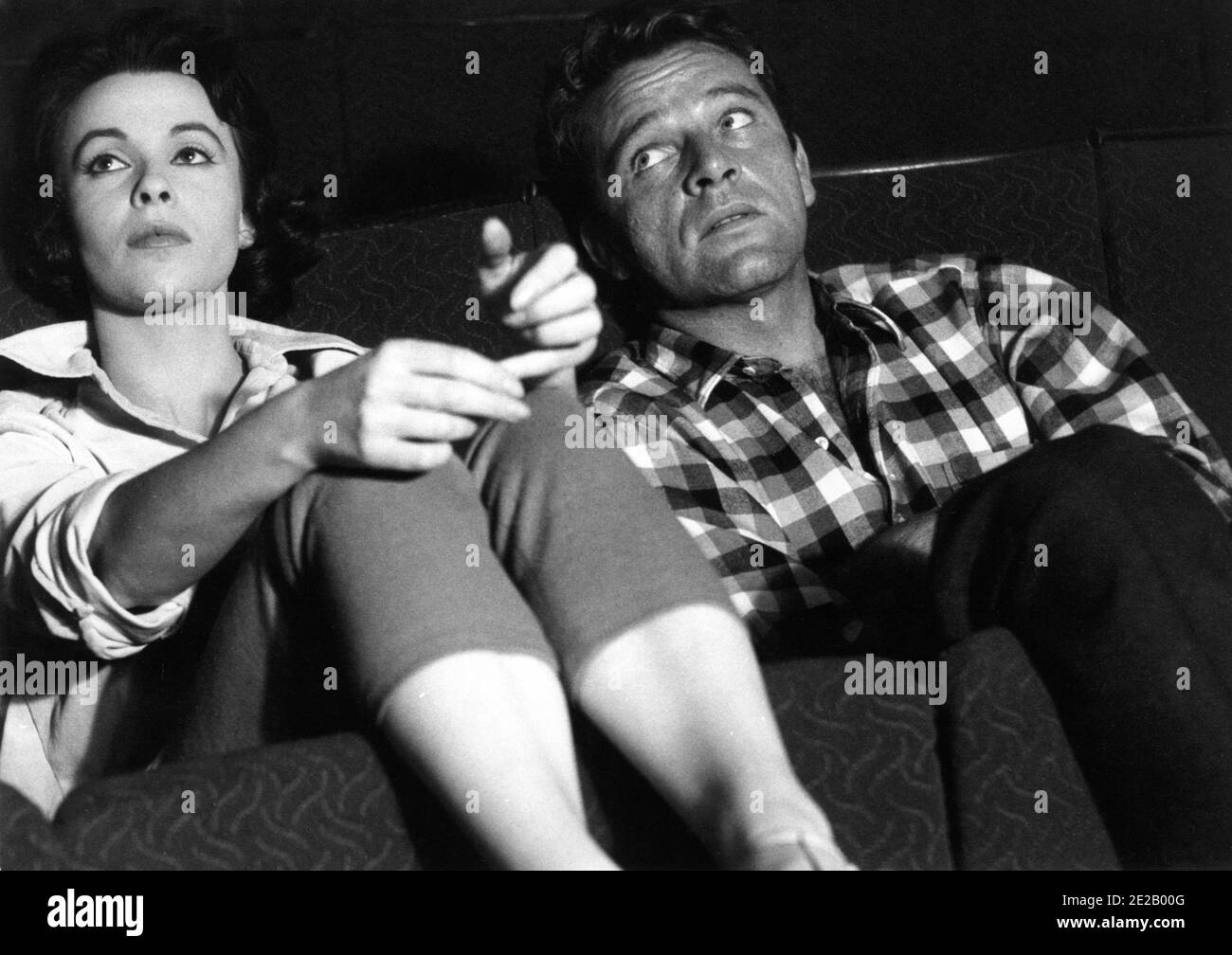 CLAIRE BLOOM and RICHARD BURTON 1958 candid at the Theatre Royal in Stratford East London during filming of LOOK BACK IN ANGER 1959 director TONY RICHARDSON screenplay Nigel Kneale from the play by John Osborne producer Harry Saltzman Woodfall Film Productions / Associated British - Pathe / Warner Bros. Stock Photo