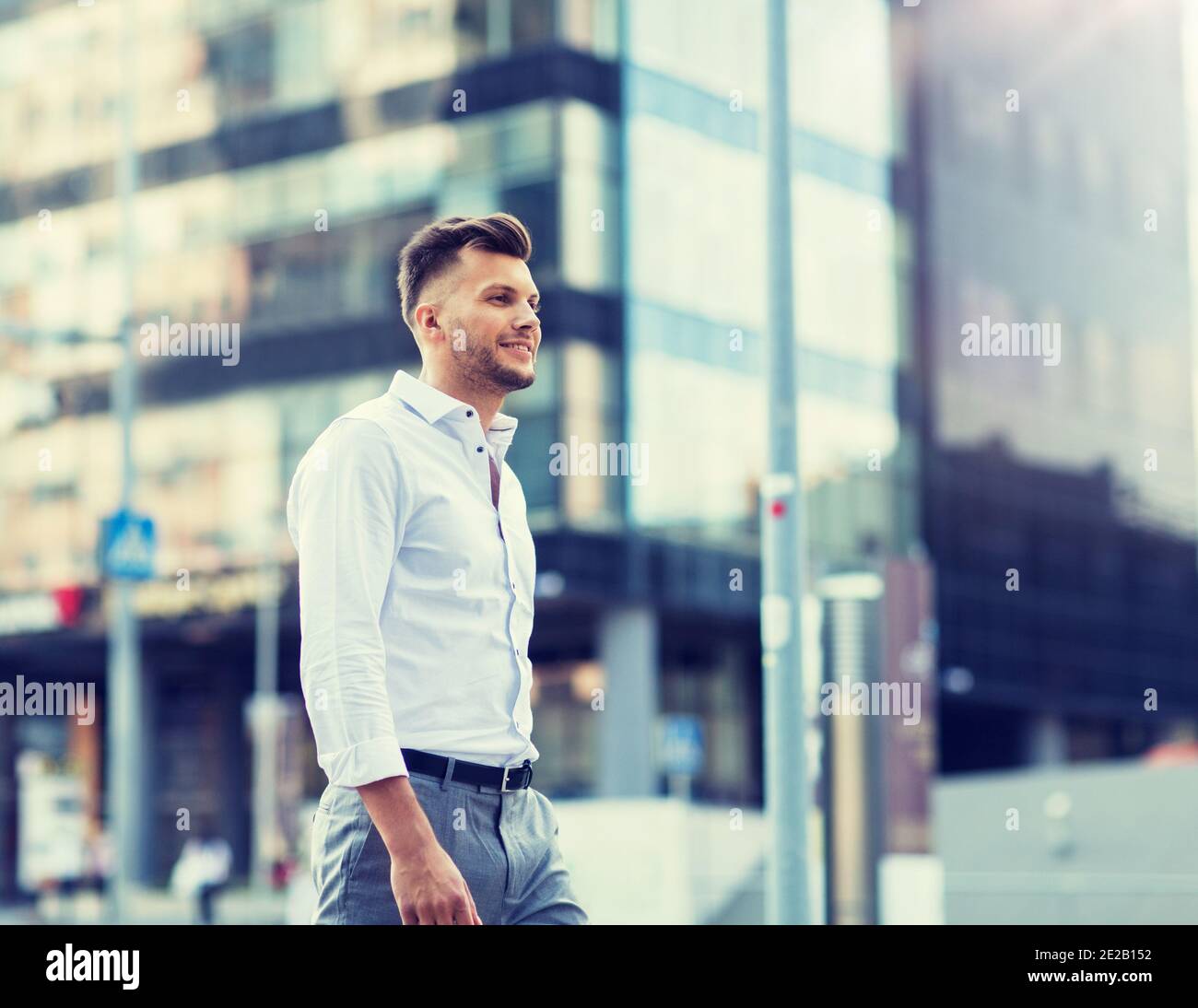 Happy confident man walking along hi-res stock photography and images ...