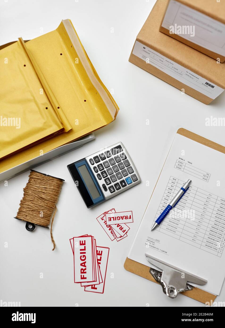 calculator, clipboard and envelopes at post office Stock Photo