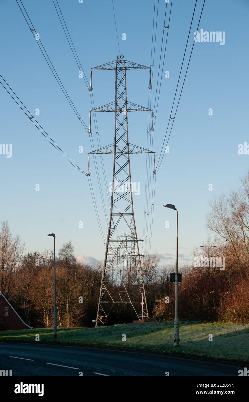 Electricity Pylon against a blue sky Stock Photo - Alamy