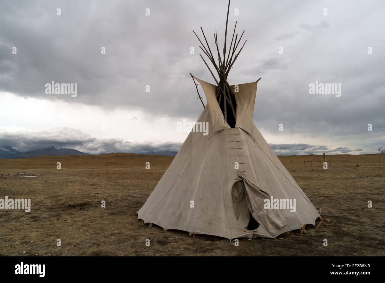 Teepee in a field on a cloudy day Stock Photo
