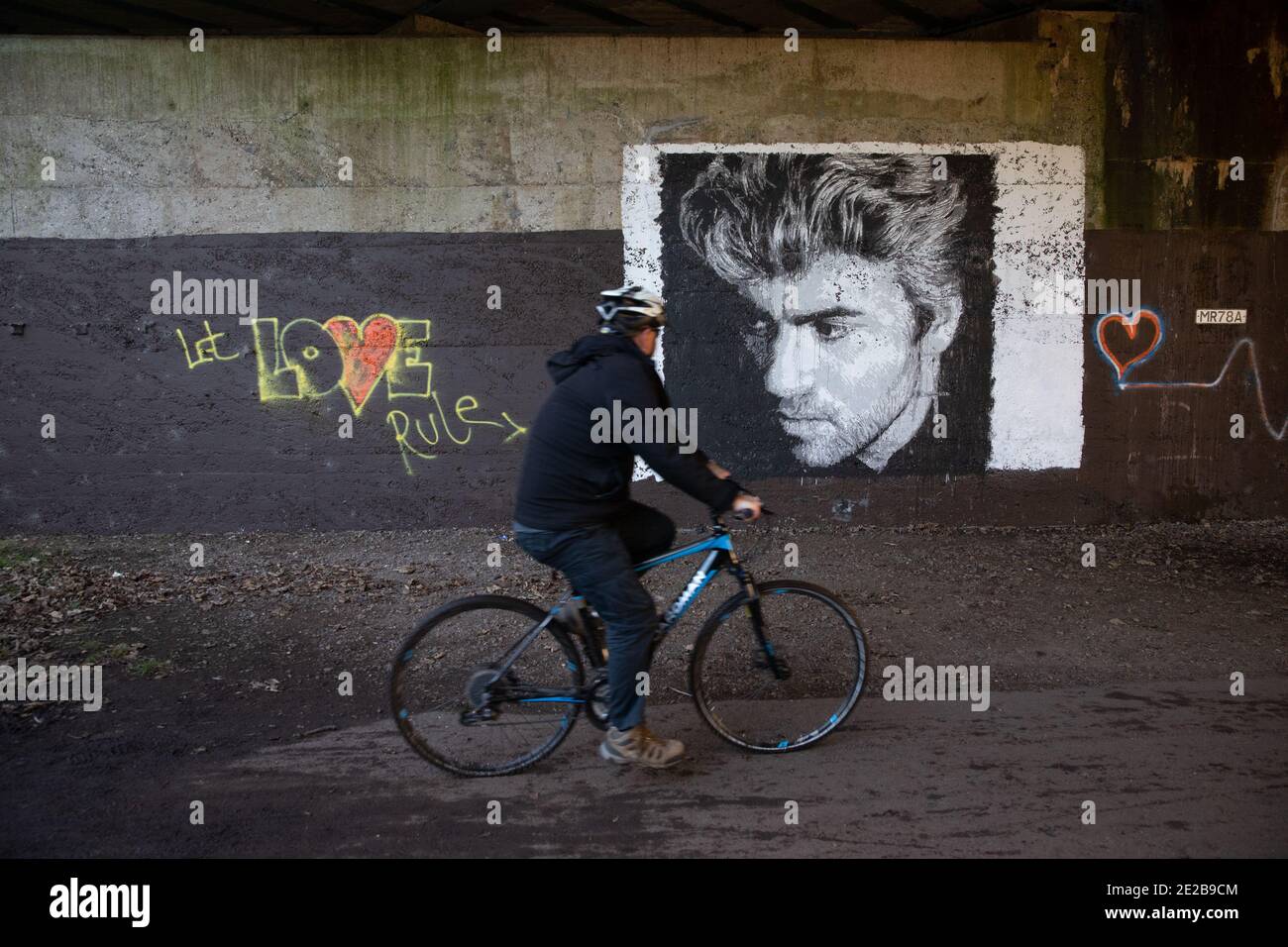 A mural depicting singer George Michael is seen on a railway overpass in Watford Stock Photo