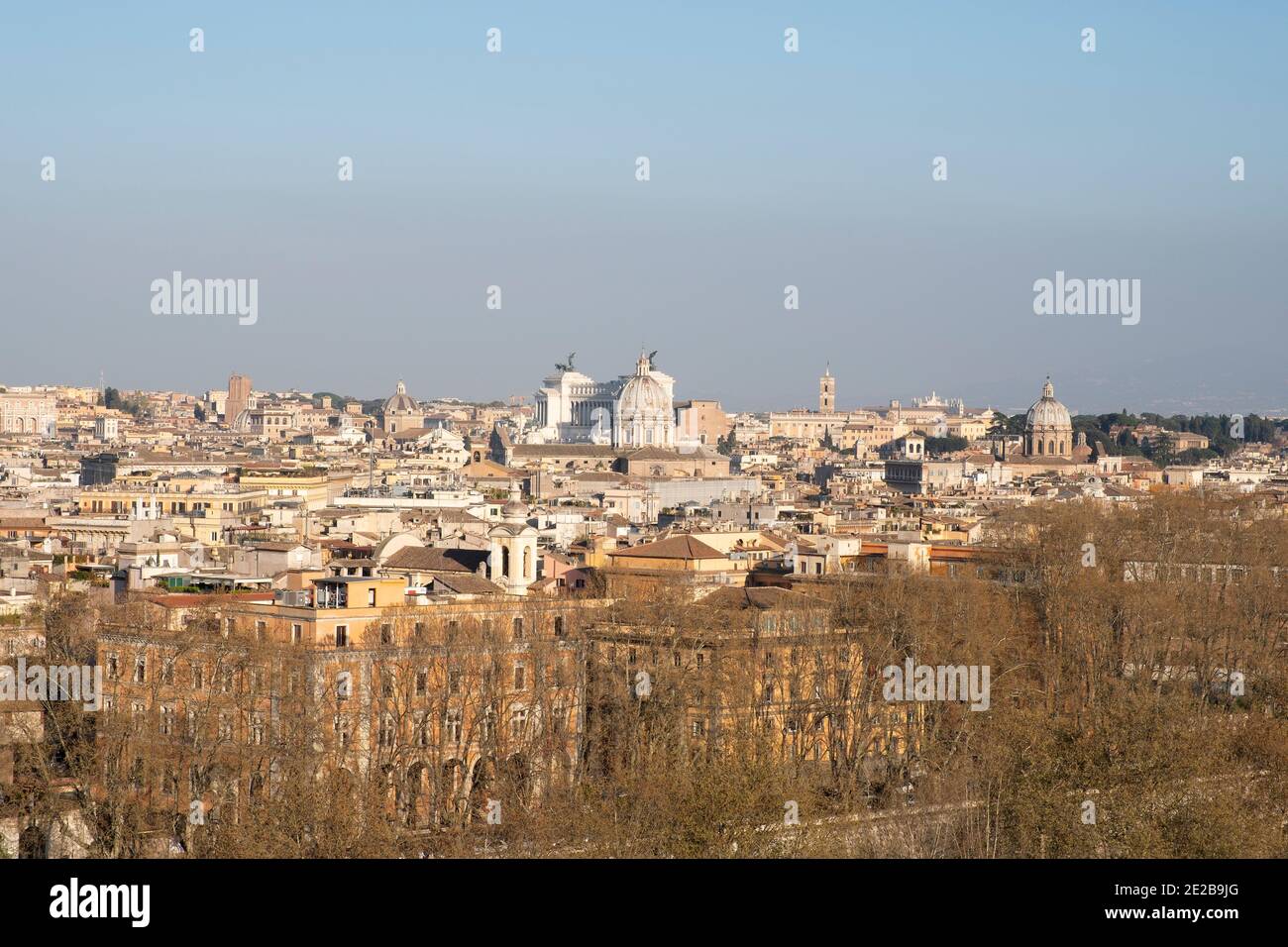 View down over rooftops of Rome, Italy, from Trastevere. In centre: Vittorio Emanuele Monument and Church of Sant' Andrea della Valle Stock Photo
