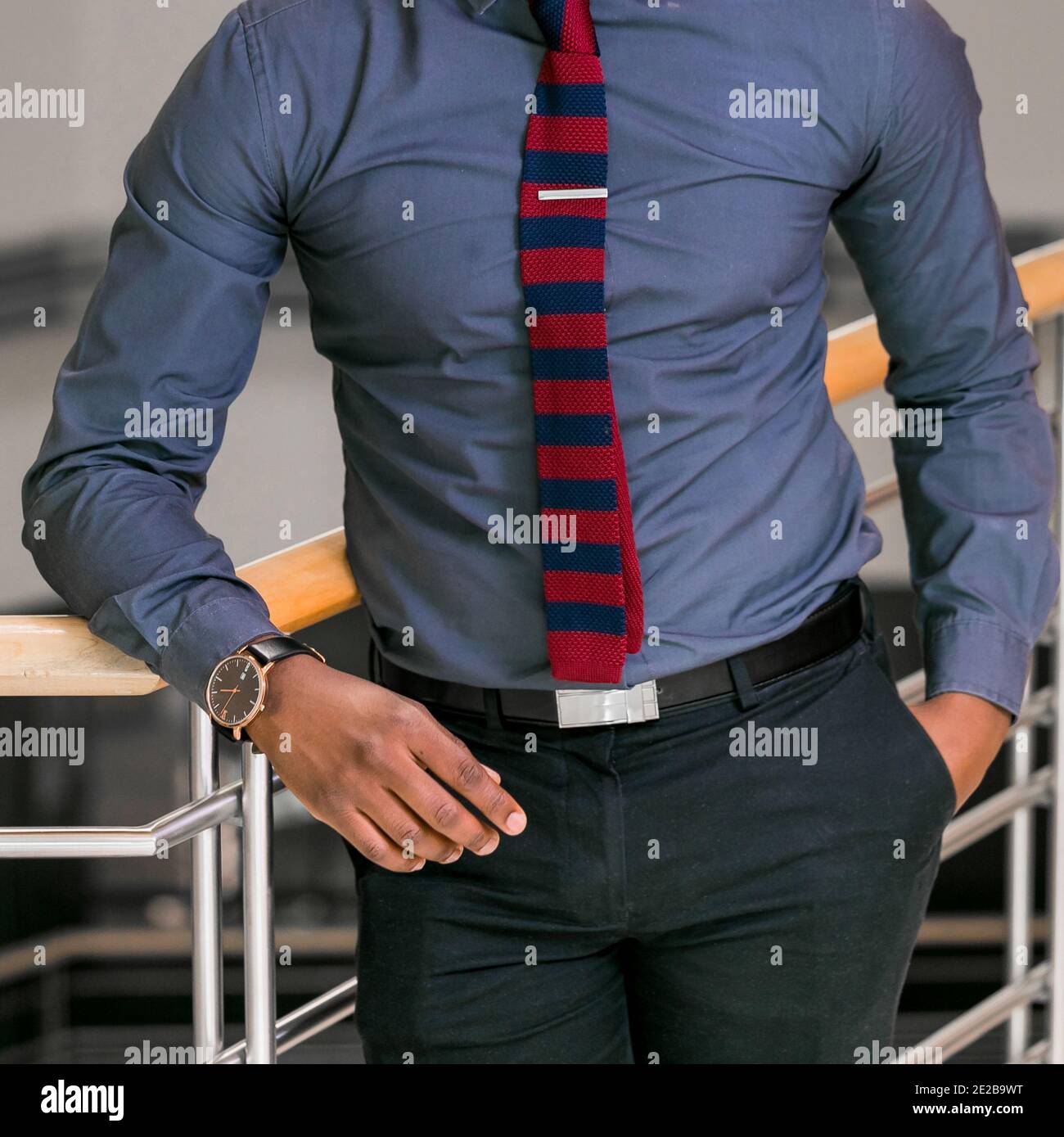 Vertical shot of a male wearing a blue 