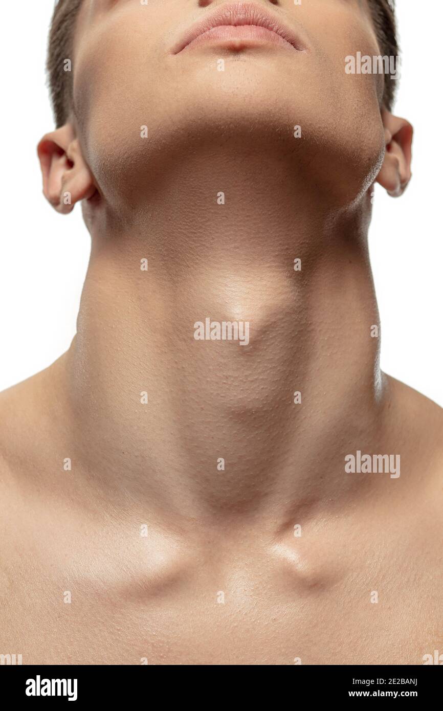 Muscular neck. Portrait of young man isolated on white studio background. Caucasian attractive