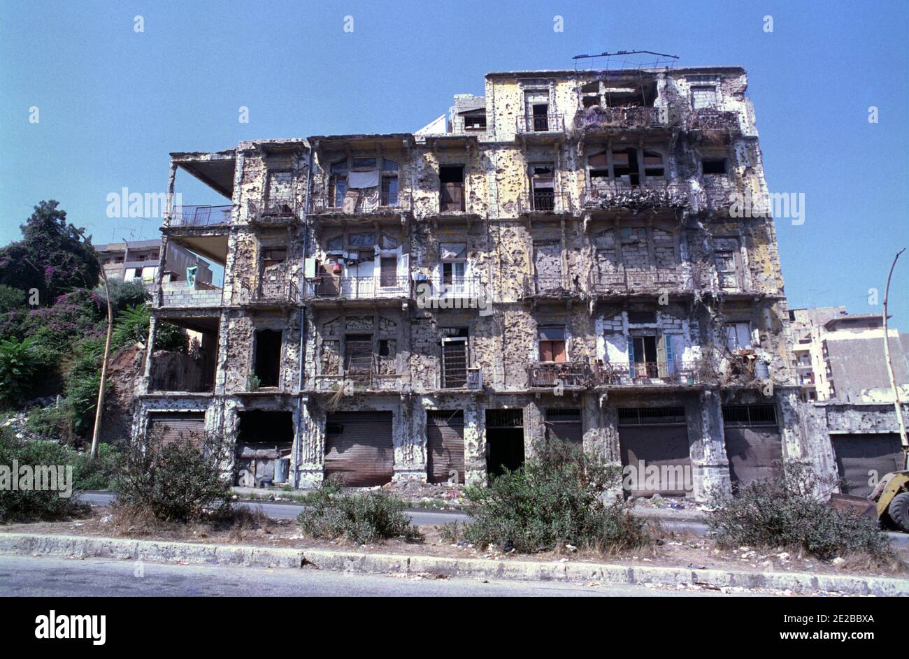 18th September 1993 After 15 years of civil war, life goes on in a battle-scarred building near the Green Line in Beirut. Stock Photo