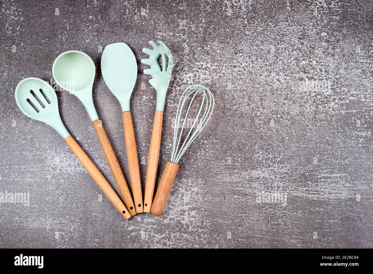 https://c8.alamy.com/comp/2E2BC84/kitchen-utensils-home-kitchen-tools-mint-rubber-accessories-on-dark-background-restaurant-cooking-culinary-kitchen-theme-silicone-spatulas-and-2E2BC84.jpg