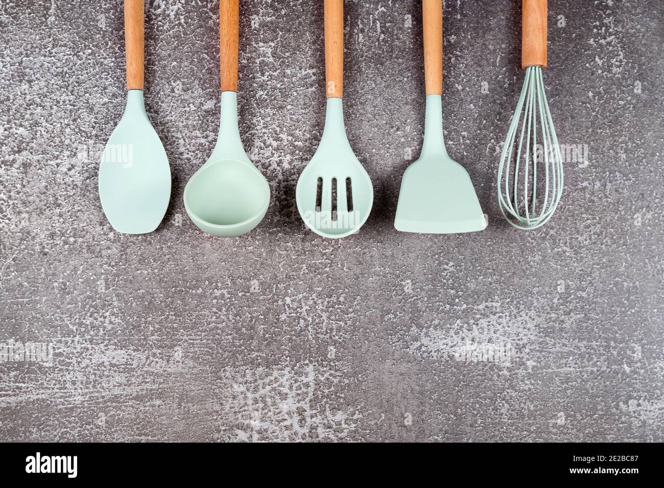 https://c8.alamy.com/comp/2E2BC87/kitchen-utensils-home-kitchen-tools-mint-rubber-accessories-on-dark-background-restaurant-cooking-culinary-kitchen-theme-silicone-spatulas-and-2E2BC87.jpg