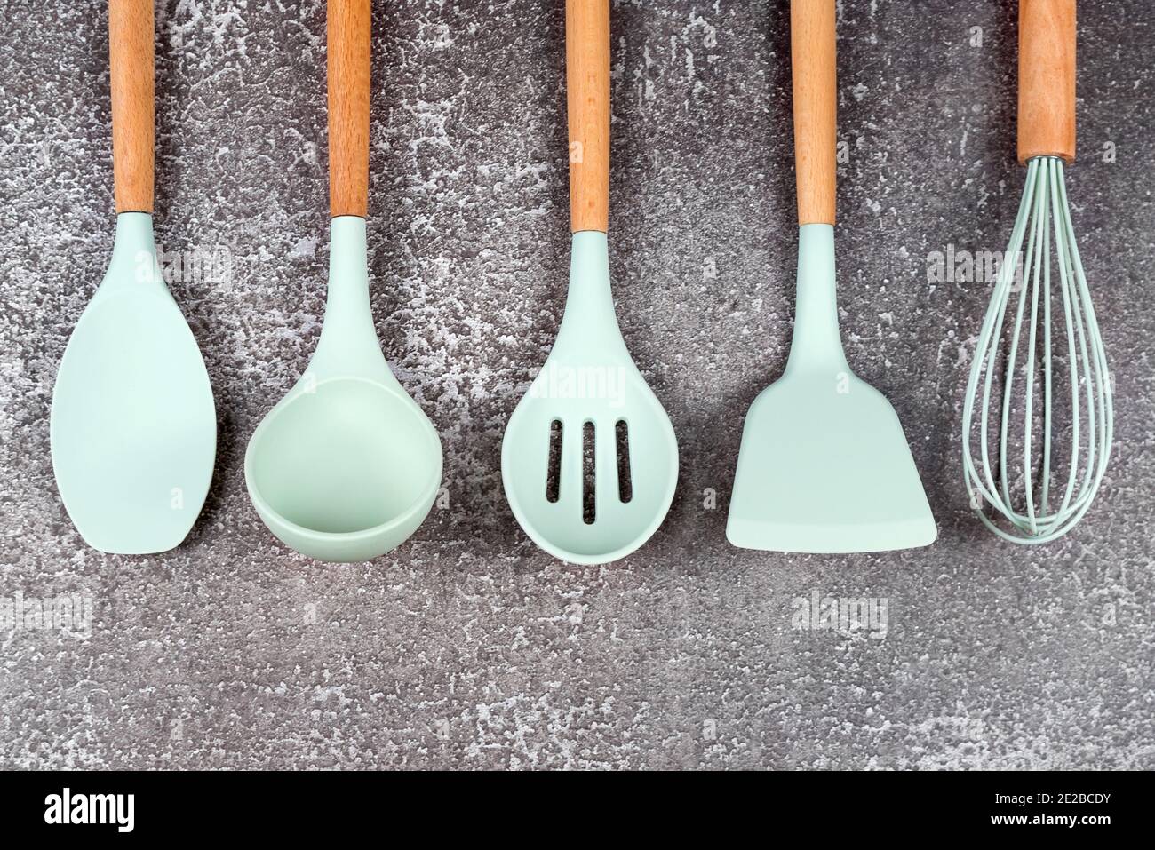https://c8.alamy.com/comp/2E2BCDY/kitchen-utensils-home-kitchen-tools-mint-rubber-accessories-on-dark-background-restaurant-cooking-culinary-kitchen-theme-silicone-spatulas-and-2E2BCDY.jpg