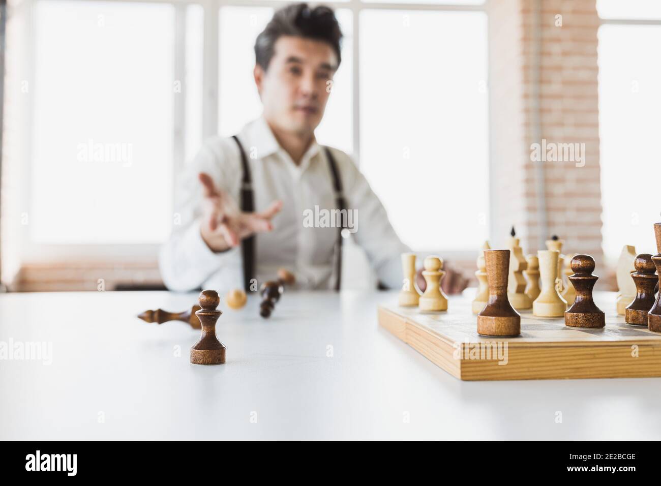 planning strategy with chess figures on an old wooden table
