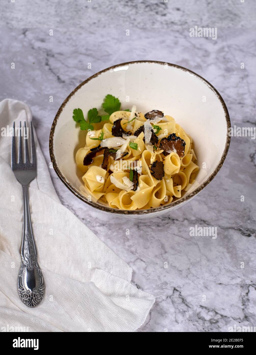 Ribbon noodles with white truffle sauce and shaved parmesan cheese ...