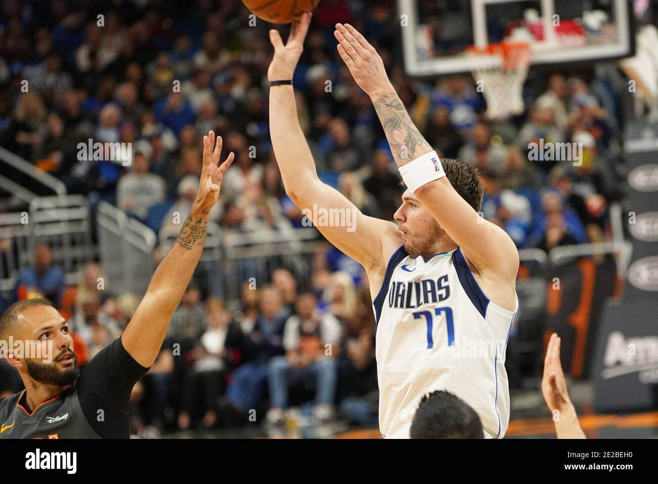 Dallas Mavericks player Luka Doncic #77 shoots a three point during the ...